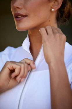 Ariat Womens Ascent 1/4 Zip Short Sleeve Show Shirt -Equestrian Supply Store S23 WMS ENGL Carmel LaCunha Shot 02 8218 RTL